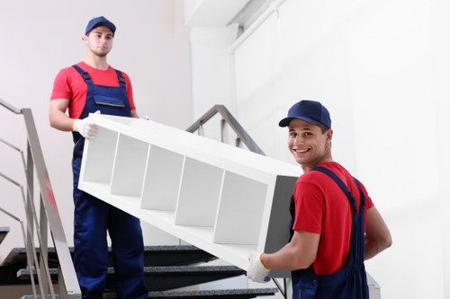 Moving team preparing items with safety-focused procedures