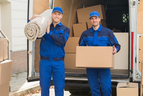 Professional movers handling household items with care