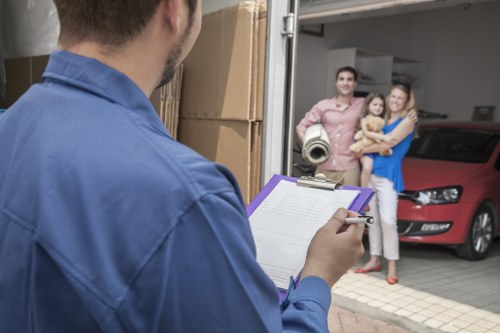 Removal team handling a home move in Richmond with packed boxes and furniture