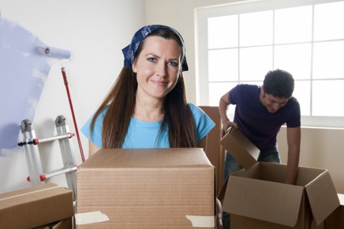 Local removal team handling household items in Richmond apartment access