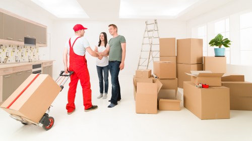 Staff following a health and safety procedure on a removals site