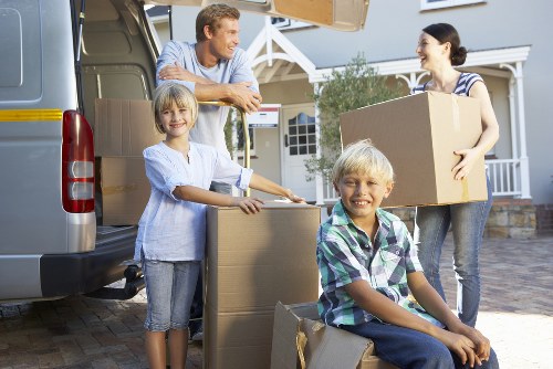 Packed moving boxes and furniture ready for transport